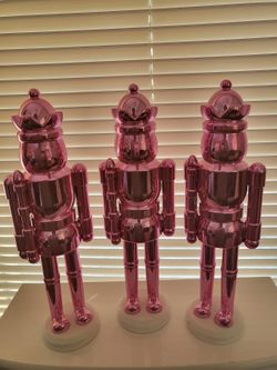 Decorative Nutcracker Figurine Modern design, glossy pink chrome finish Perfect for home decor or holiday decoration Excellent condition