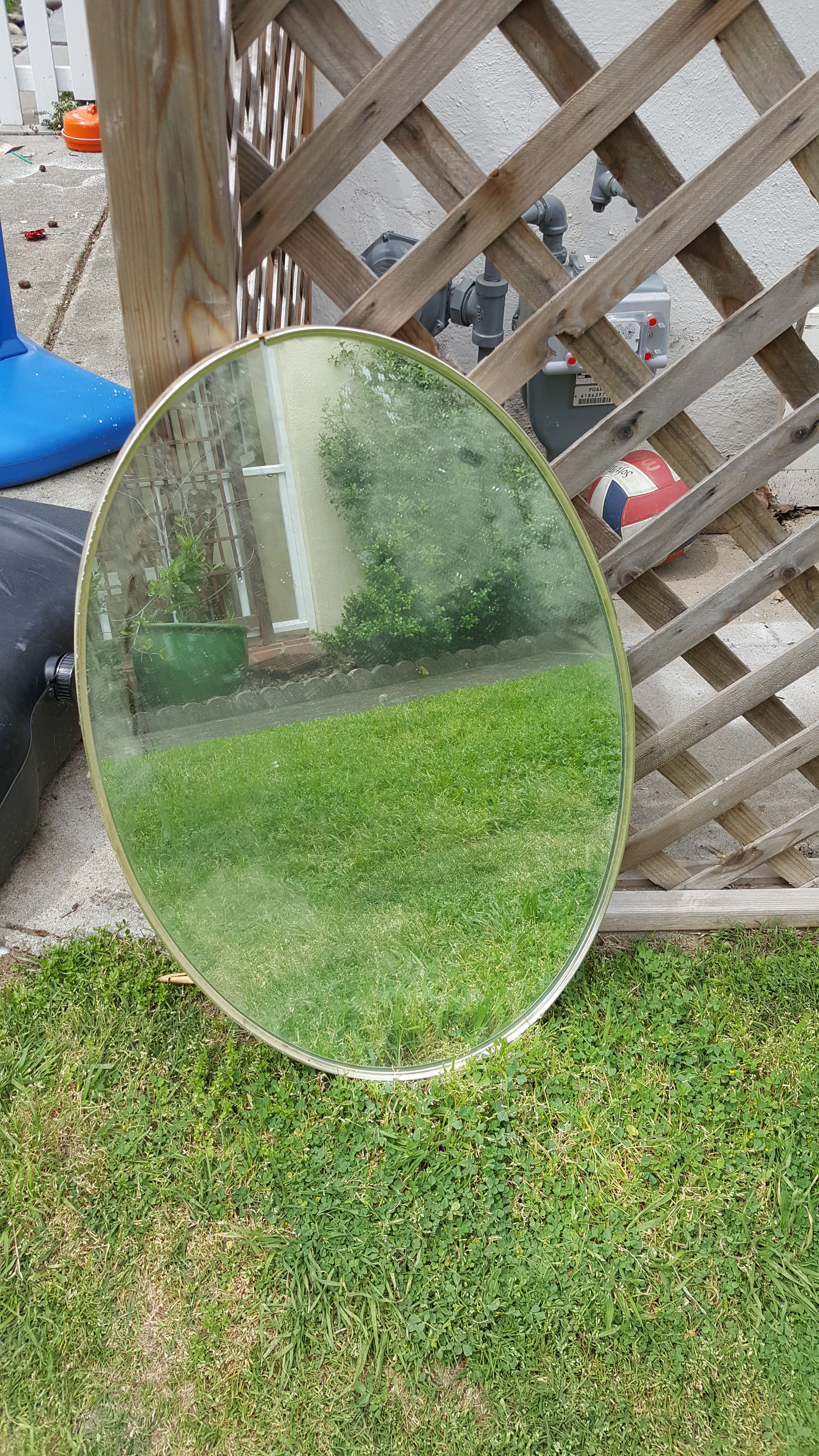 Heavy oval mirror