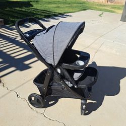Black Graco Stroller With All Weather Protector.