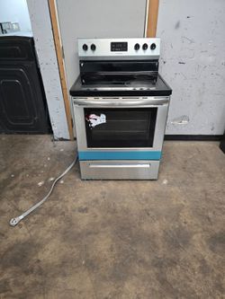 whirlpool five burner stainless steel glass top electric stove.