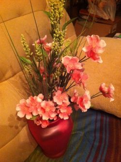 Pink vase filled with flowers