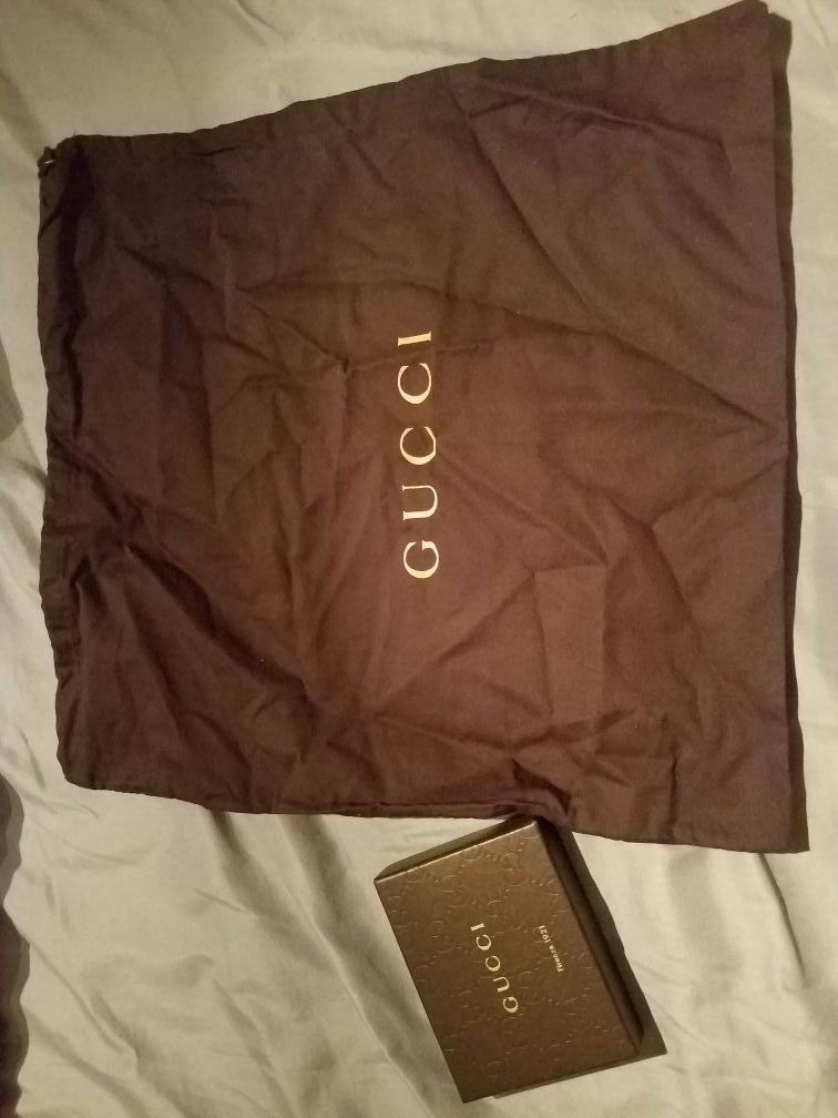Gucci box and dust bag.