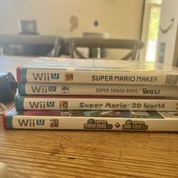 Wii Stuff with Controllers And Mario and Mario Cart Games