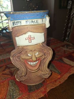 5 pottery faces mugs