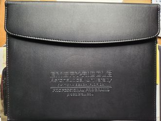 Black vinyl writing paper pad holder with inside pocket, pen holder and 2 business card holders. Button magnet closure
Measures about 12.5" inch tall 