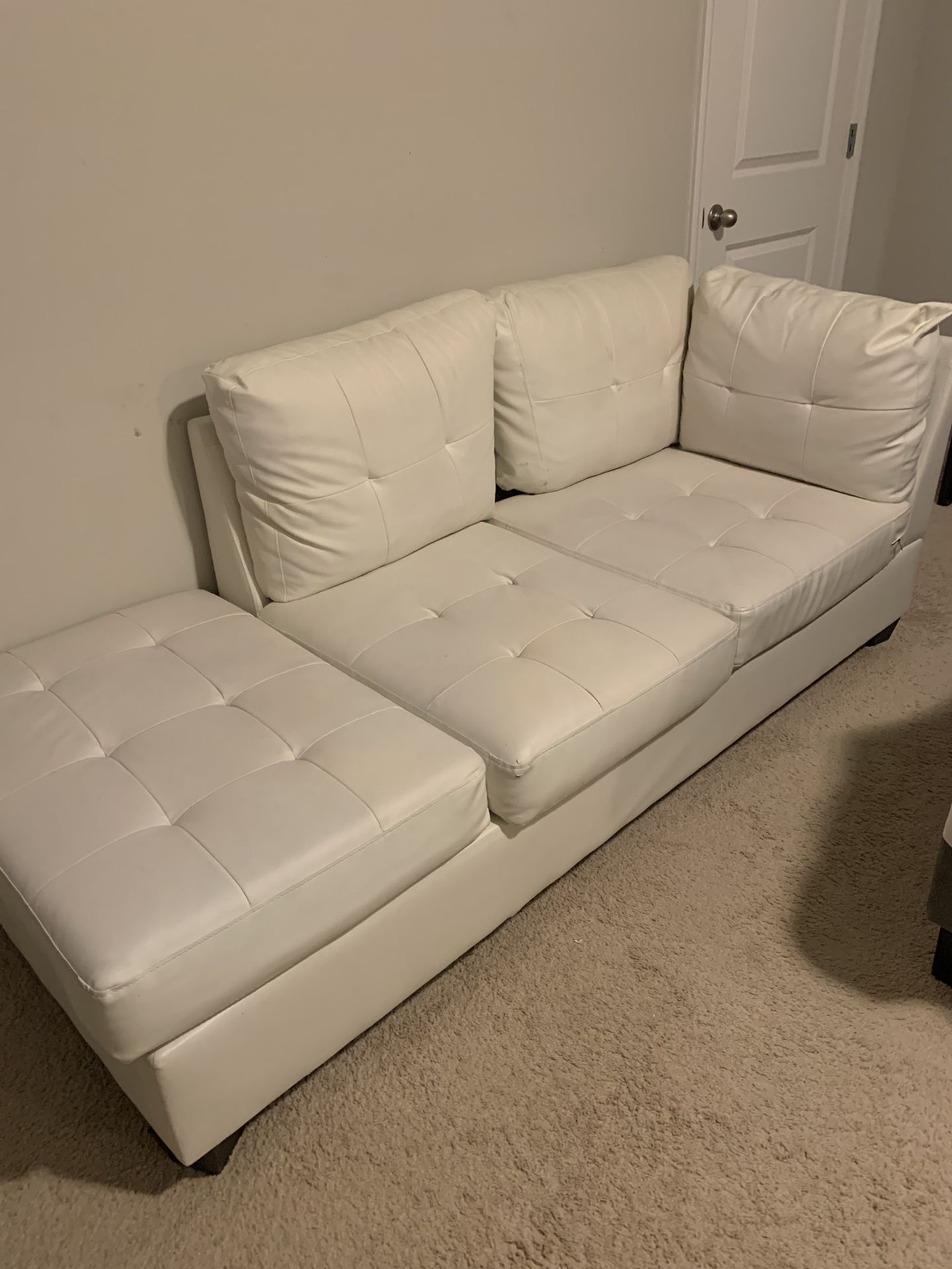 2 piece White leather couch.