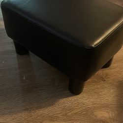 black leather ottoman