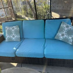 Patio furniture, one couch and two chairs