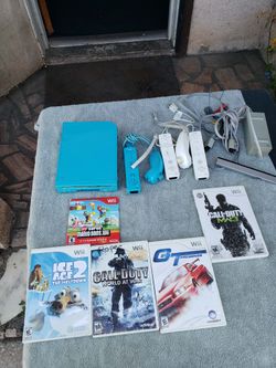 Nintendo wii Limited edition Sonic Blue. With all cables & sensors with 5 Great Games. 3 pair of controllers $200! Or trade up