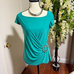 Elegant women’s top draped with decorative silver toe ring