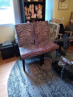 Two Brown And Cream Zebra Print Dining Chairs
