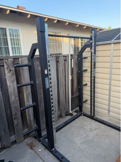 Squat rack with pull up bar. Missing the hooks