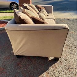 BEIGE PULL OUT SOFA .