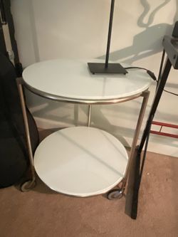 End Table , Round W/ Wheels White Glass Top And Bottom