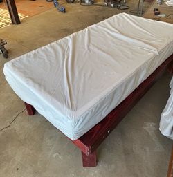 Solid wood, twin bed frame. Includes fairly new twin mattress non-smoking house has always used mattress cover.