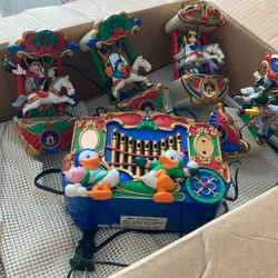  This is a vintage animated musical carousel featuring Disney characters like Mickey Mouse, Donald Duck, and Goofy, designed for holiday decor. 