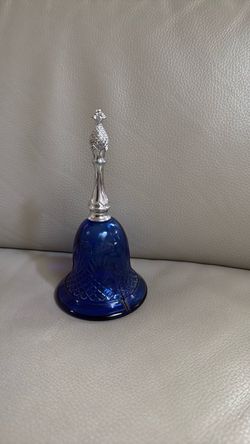 Blue glass bell shaped bottle