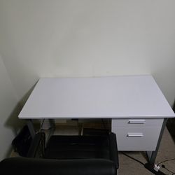 Office table and swivel chair