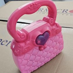 Cartera con luces,guitarra,walkie talkie,caballos Frozzen y Spirit