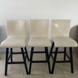 3 breakfast bar stools. Leather and wood. In good condition.