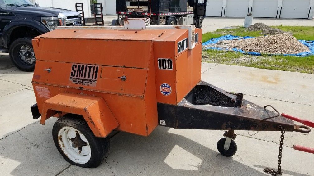 Concrete mixer, concrete buggy with trailer and pull behind air
