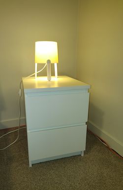 Two bedside tables and two lamps—all from IKEA