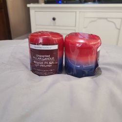 New. (2) Red, White, and Blue Unscented Pillar Candles.