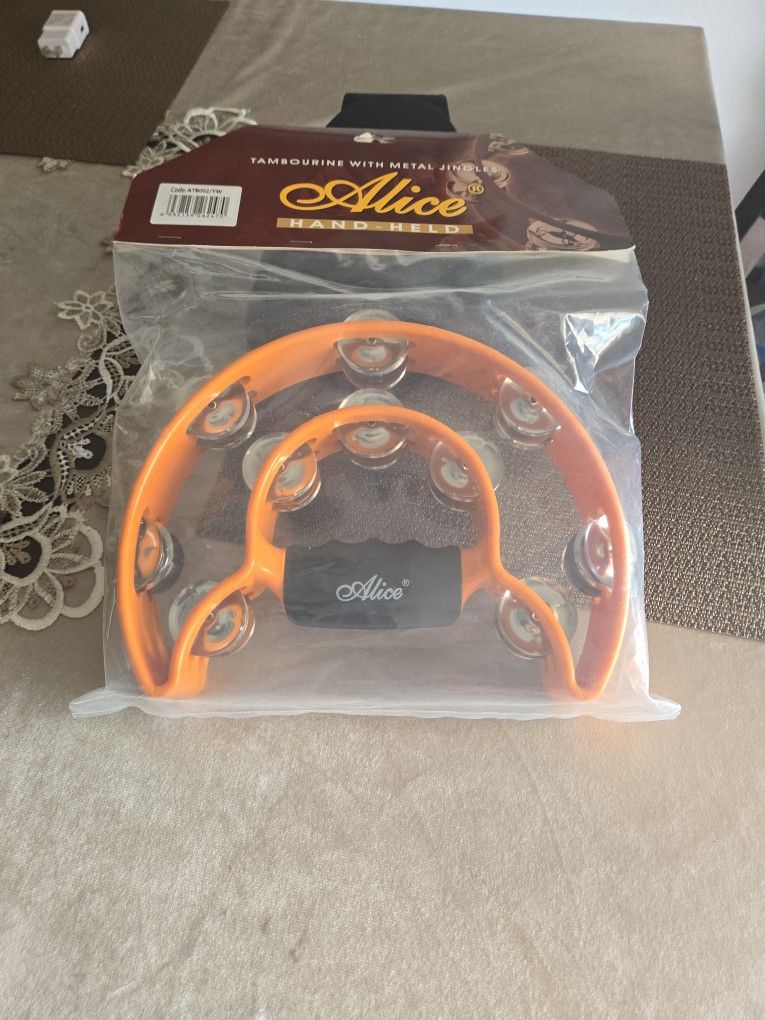 BRAND NEW  , TAMBOURINE  .