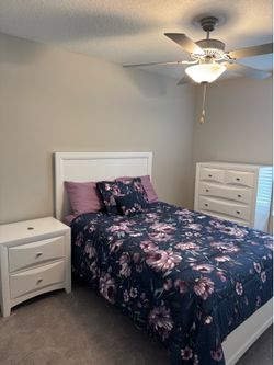 White full-size bed with nightstand and six drawer dresser