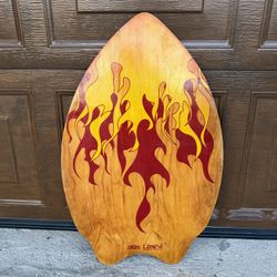 Skim Lizard wooden skimboard, featuring a distinctive fire flame design