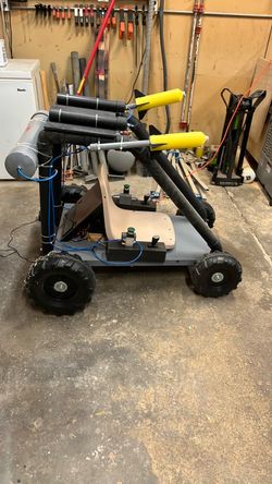 Electric cart with rockets and ping pong ball smoke screen