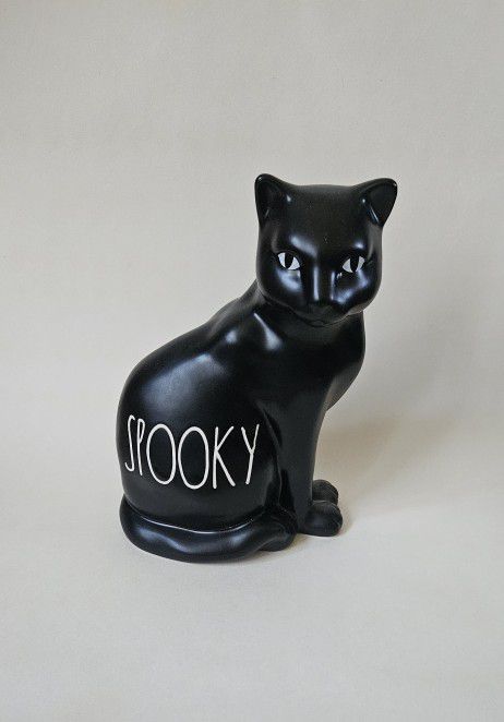 Rare Rae Dunn Halloween Black white Spooky kitty Cat Ceramic figurine Decoration Measures 7.5"L x 5.5"W x 7.5"H Add a touch of spookiness to your Hall
