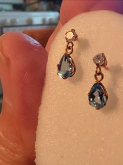 14k gold filled, diamond at end of stud with a dangling  blue topaz