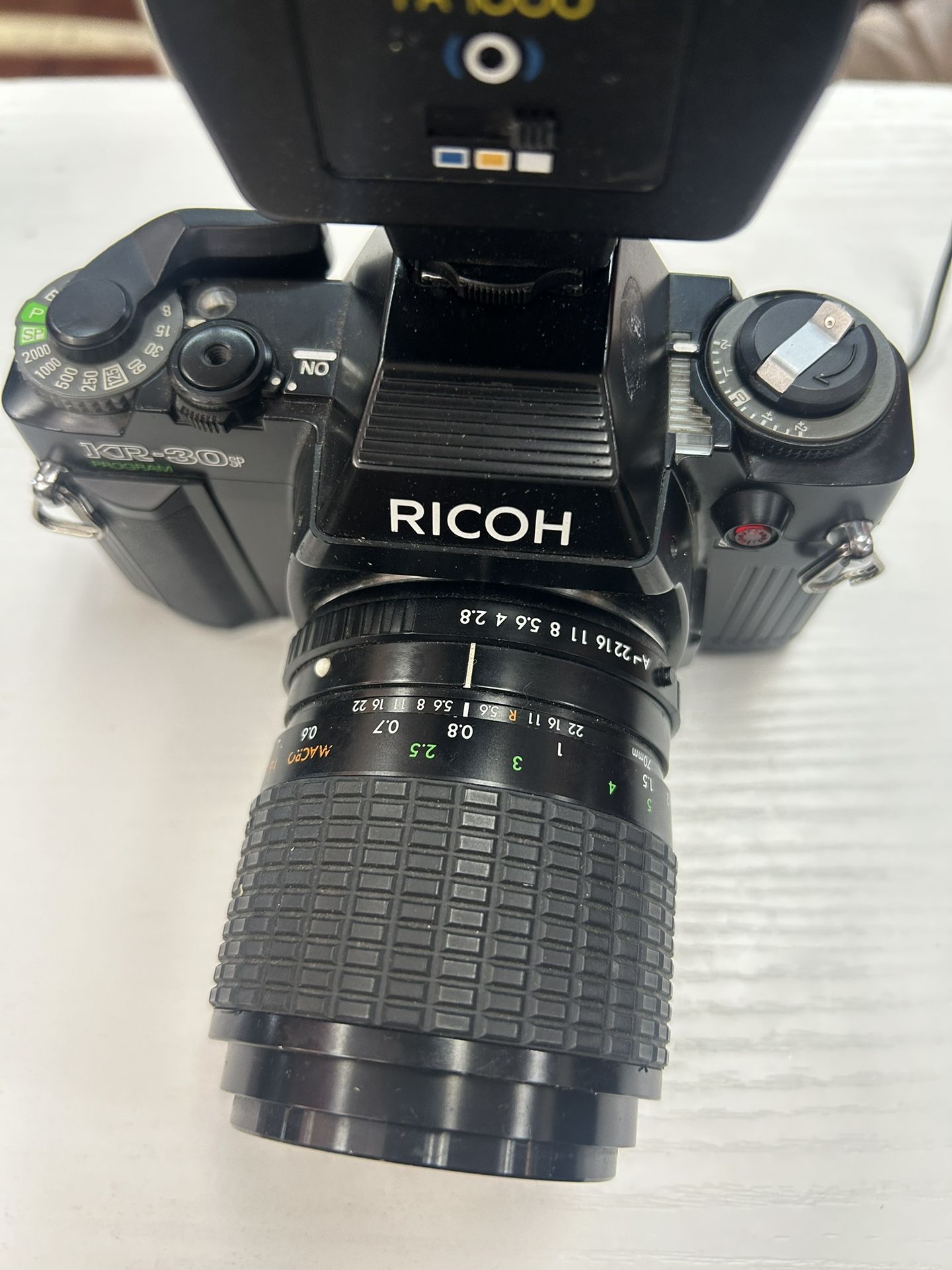 Ricoh KR-30SP 35mm SLR film camera with a Sigma Zoom-Master lens and a Promatic FA 1000 flash unit