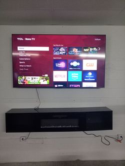 85" TV and fireplace