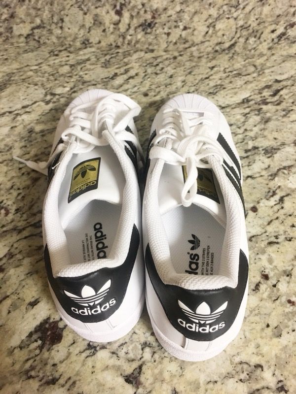 Brand new Adidas size 9.5