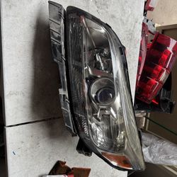 Chevy Malibu left headlight Oem