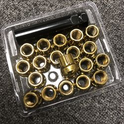 Gold lug nuts with locking key.