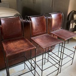 3 matching iron and leather barstools. Nice!