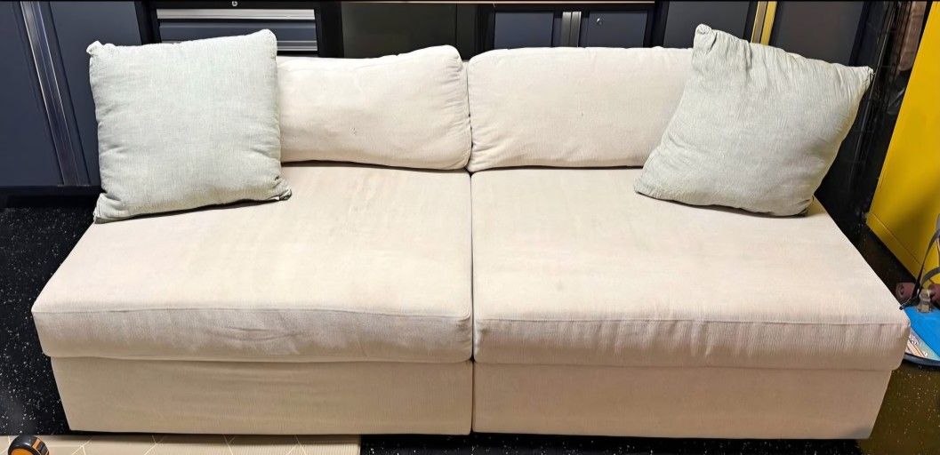 Living Spaces 2 Piece Armless Modular Sofa.