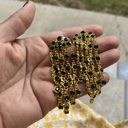 Green rhinestone dangles gold tone