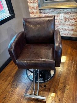 Brown hair cutting chair