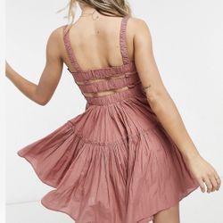 Mini sundress with raw edges in dusty pink. 