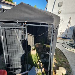 Dog cage with weatherproofing