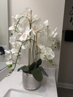 Faux flower and silver vase