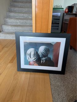 Two framed Magritte prints