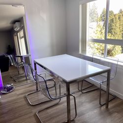 White IKEA Dining Table With Acrylic Chairs