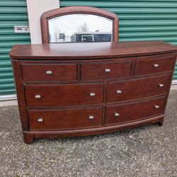Curved Front 7 Drawer Wood Dresser With Mirror