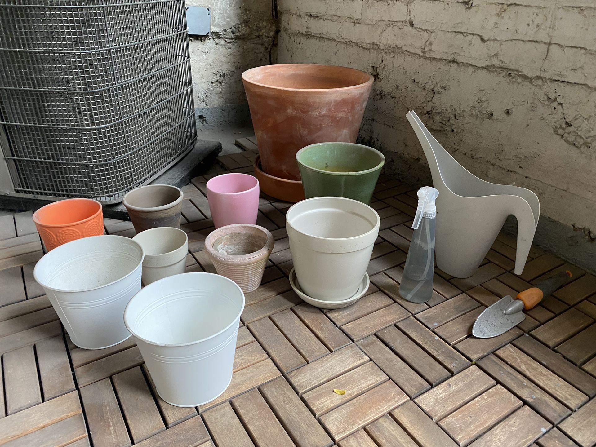 Assorted Plant Pots With Watering Can And Spade