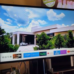 42" Samsung smart tv 4k with tv stand mounted shelves glasses.  Selling together they are excellent condition.  Tv has great quality pics no scratch 